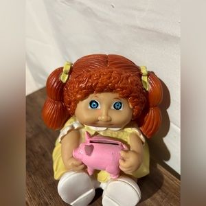 Cabbage path kids coin bank red hair yellow dress holding  pig with coin slot